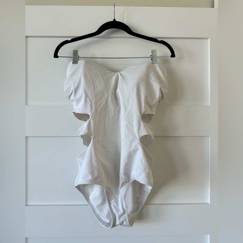 Victoria secret swim suit. Older style. Underwire. White. Cute side cutouts.